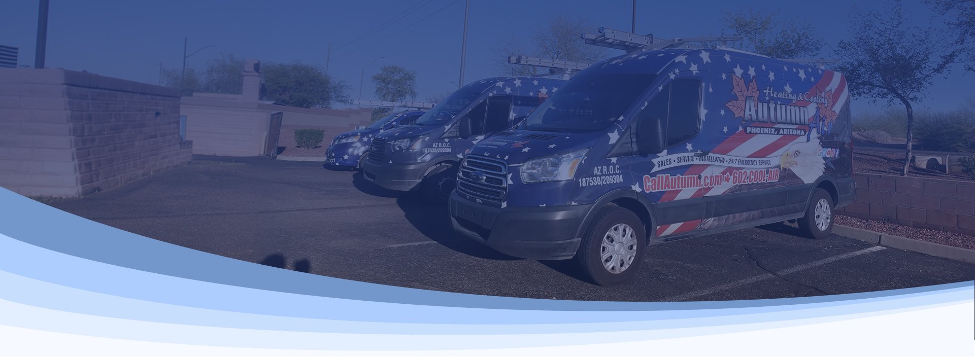Autumn Air's fleet of American flag-wrapped service vans parked at the company's Phoenix headquarters.