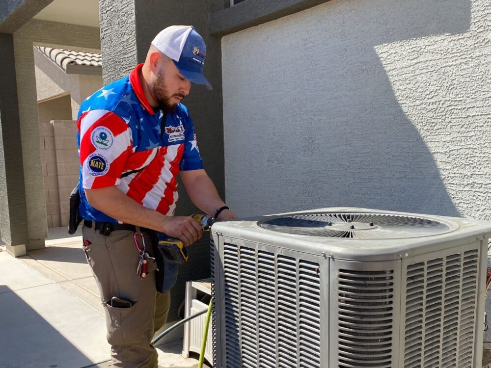 Autumn Air technician servicing air conditioner
