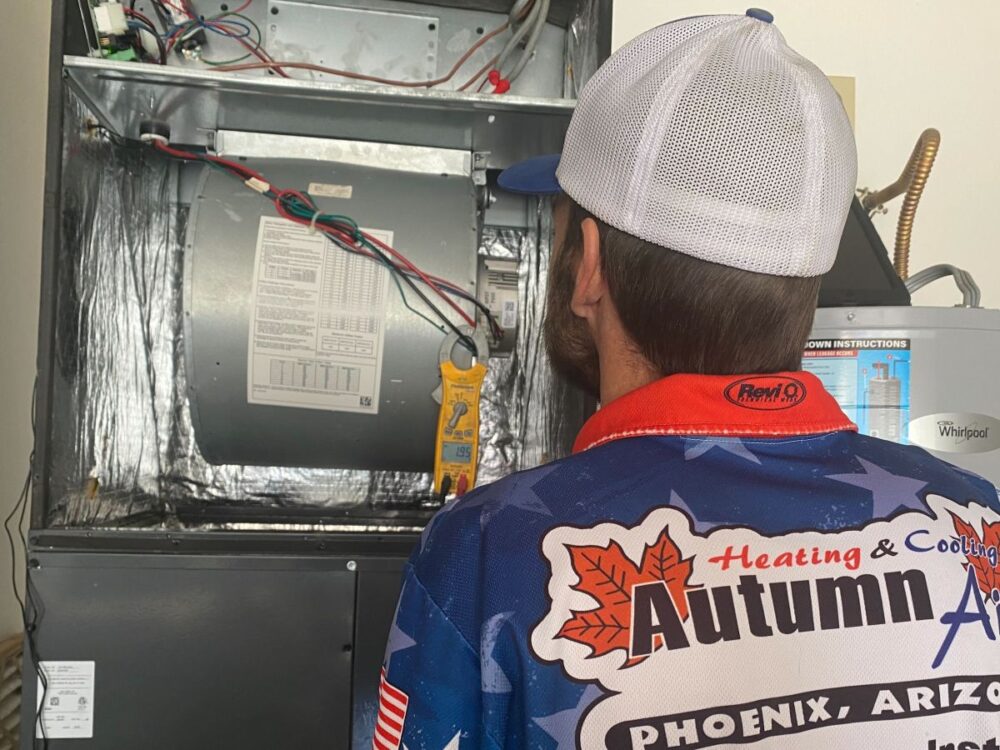 Autumn Air technician servicing a furnace