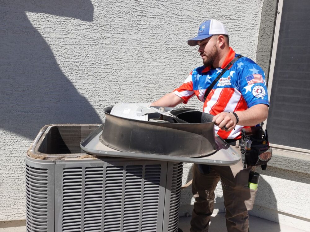 Autumn Air technician servicing air conditioner