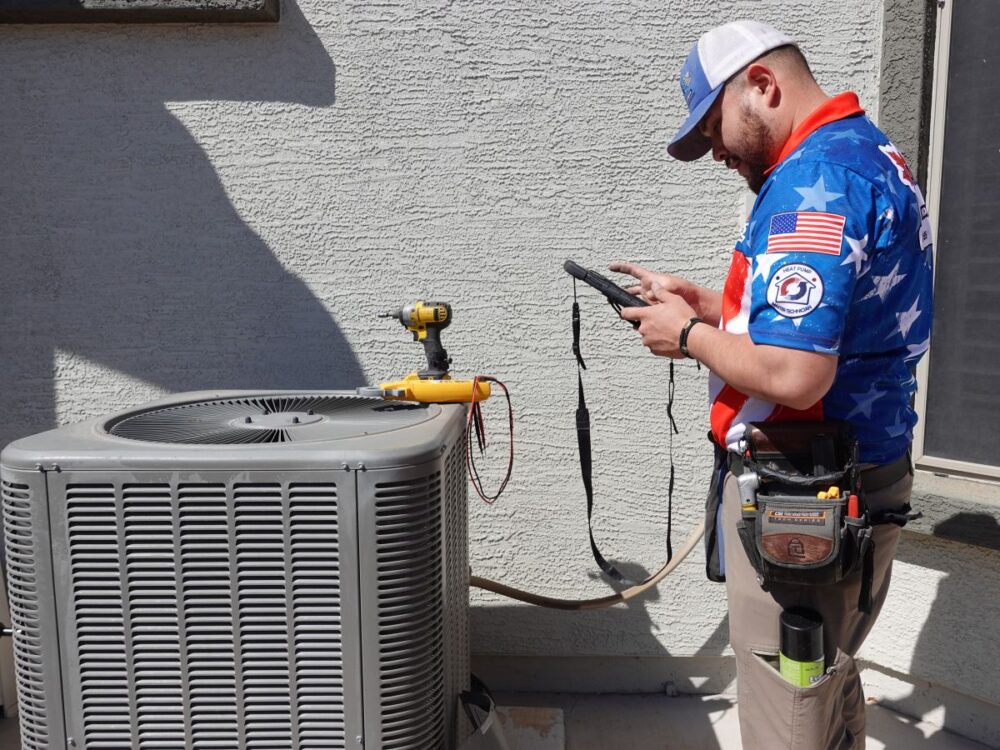 Autumn Air technician servicing air conditioner