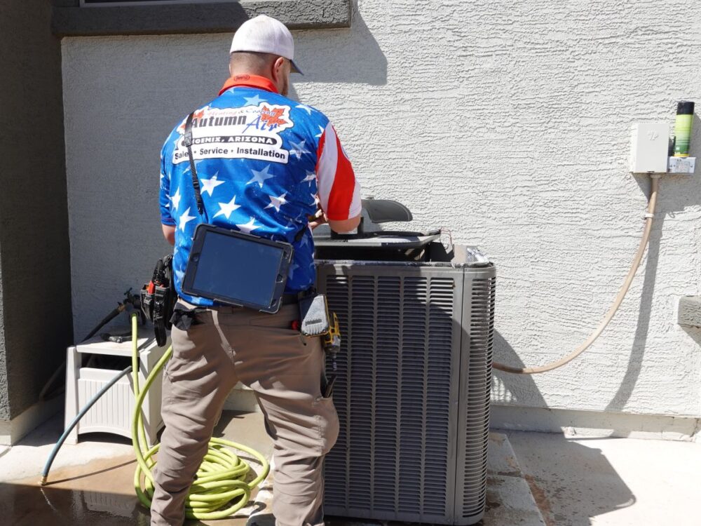 Autumn Air technician servicing air conditioner